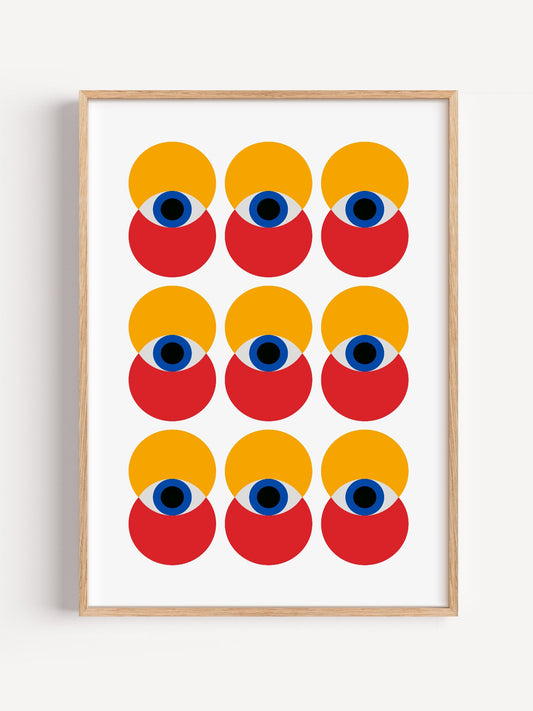 Nine stylized geometric faces in grid pattern with yellow circles, red shapes, close-up showing print texture and color de...