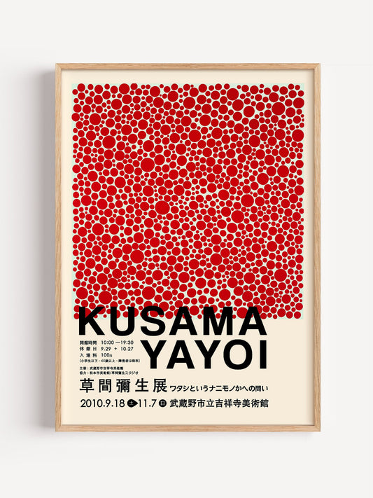 Kusama Yayoi exhibition poster with red polka dots scattered on cream, close-up showing print texture and color detail