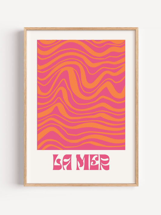 Abstract wave art print with flowing pink and orange wavy bands, La Mer text, close-up showing print texture and color detail