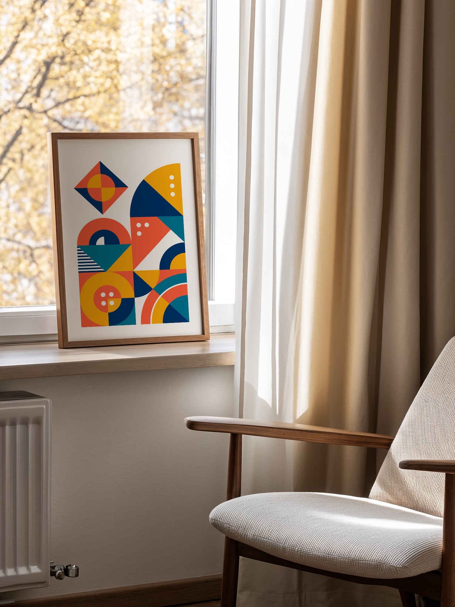 Geometric abstract wall art with interlocking shapes in coral red, navy blue, mounted in bright gallery wall arrangement