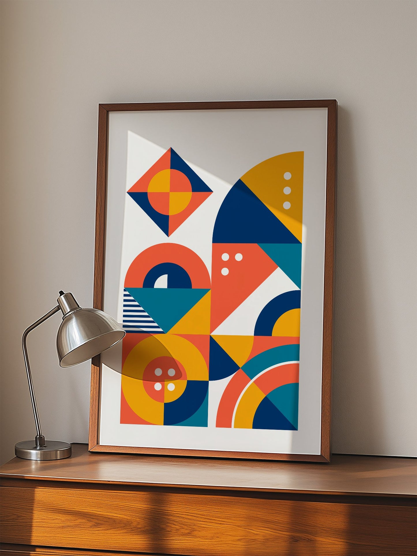 Geometric abstract wall art with interlocking shapes in coral red, navy blue, displayed in modern living room setting