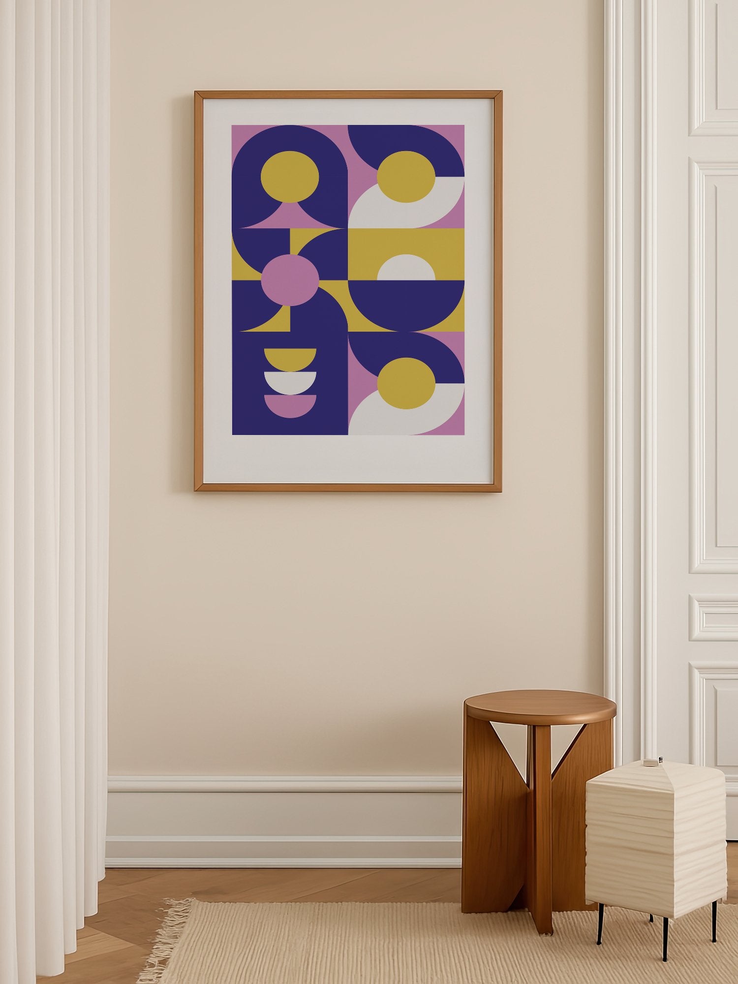 Geometric abstract wall art with navy blue curved shapes, golden yellow, shown in minimalist home office space
