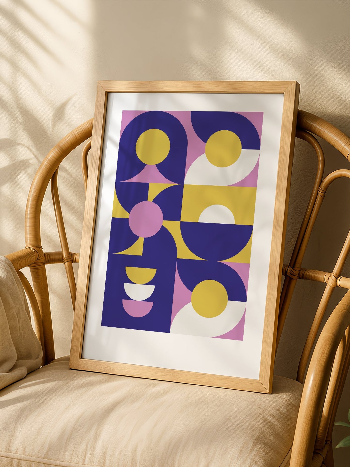 Geometric abstract wall art with navy blue curved shapes, golden yellow, shown in minimalist home office space
