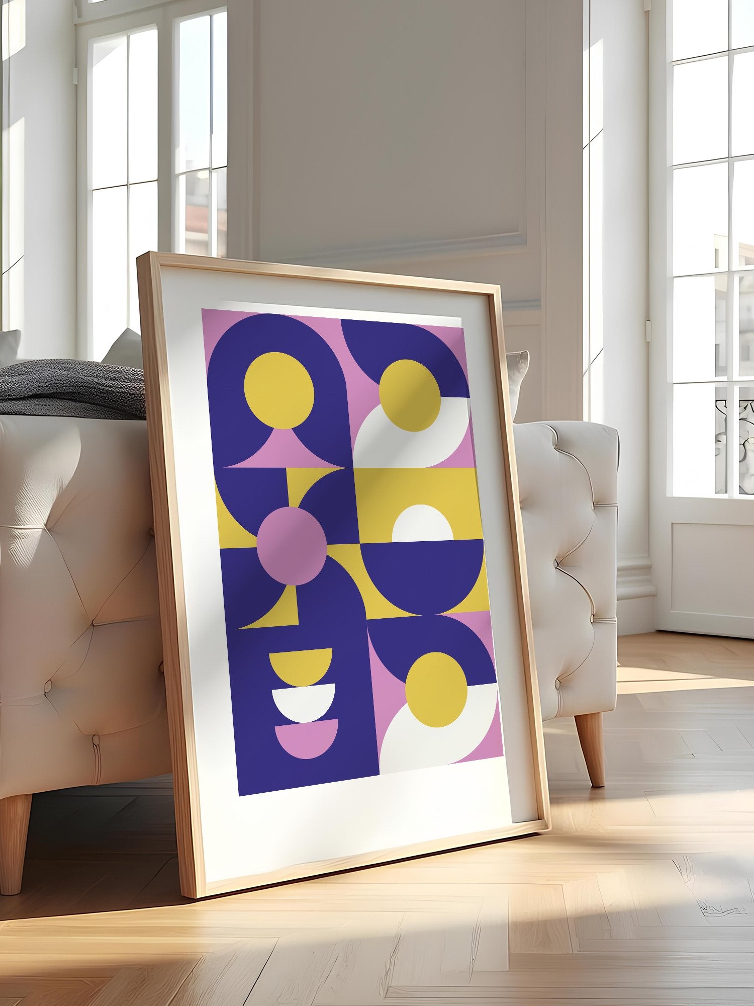 Geometric abstract wall art with navy blue curved shapes, golden yellow, featured in stylish apartment decor