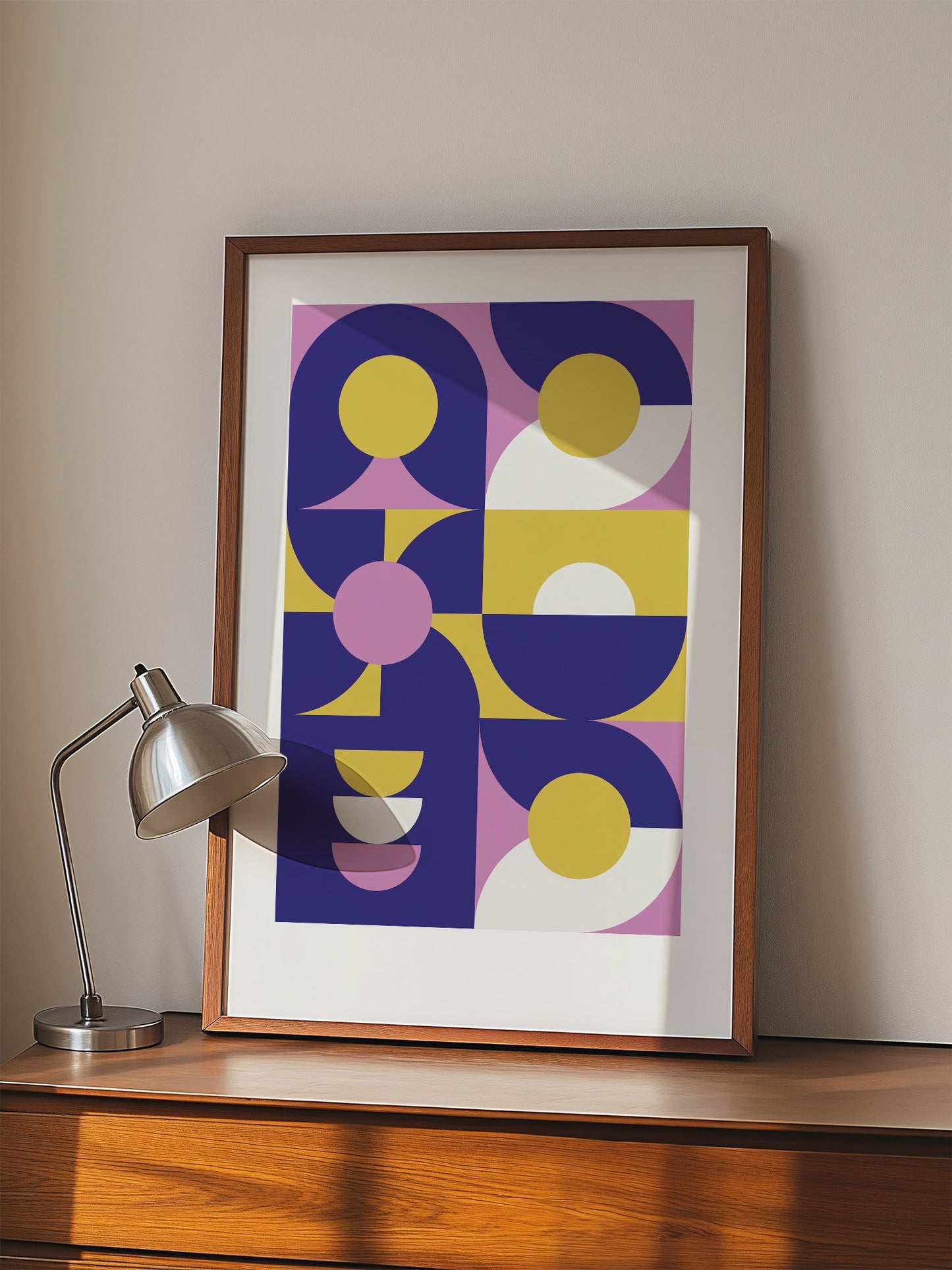 Geometric abstract wall art with navy blue curved shapes, golden yellow, displayed in modern living room setting