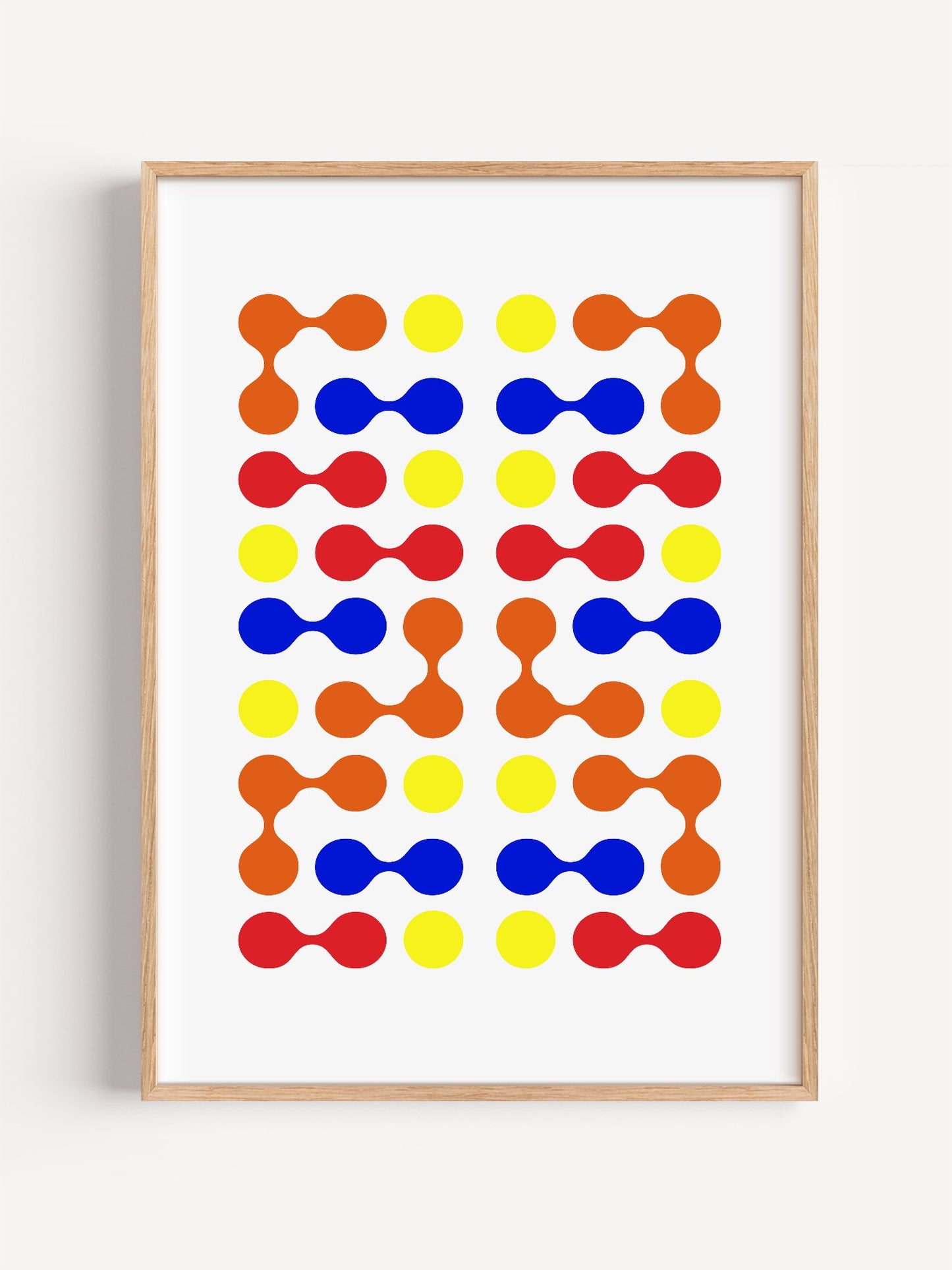 Mid-century modern geometric print with colourful molecular shapes in orange, close-up showing print texture and color detail
