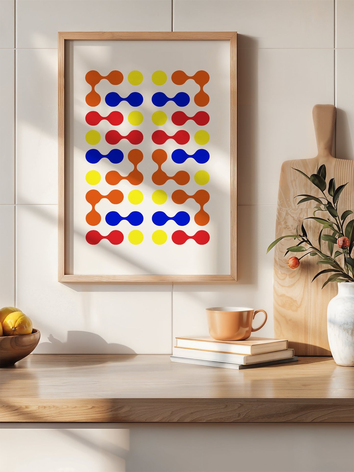 Mid-century modern geometric print with colourful molecular shapes in orange, hanging in contemporary bedroom interior