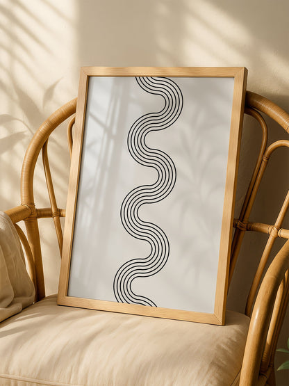 Minimalist abstract wall art with flowing black wave lines creating S-curve, shown in minimalist home office space