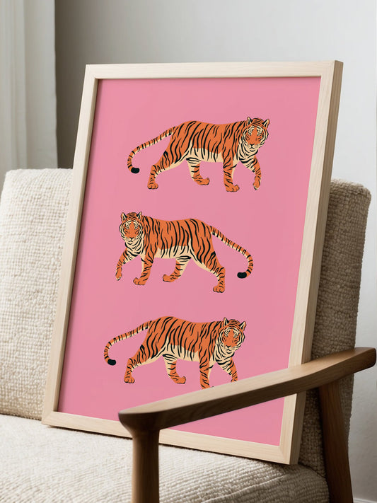Three stylized tigers walking on pink background, pop art illustration with, displayed in modern living room setting
