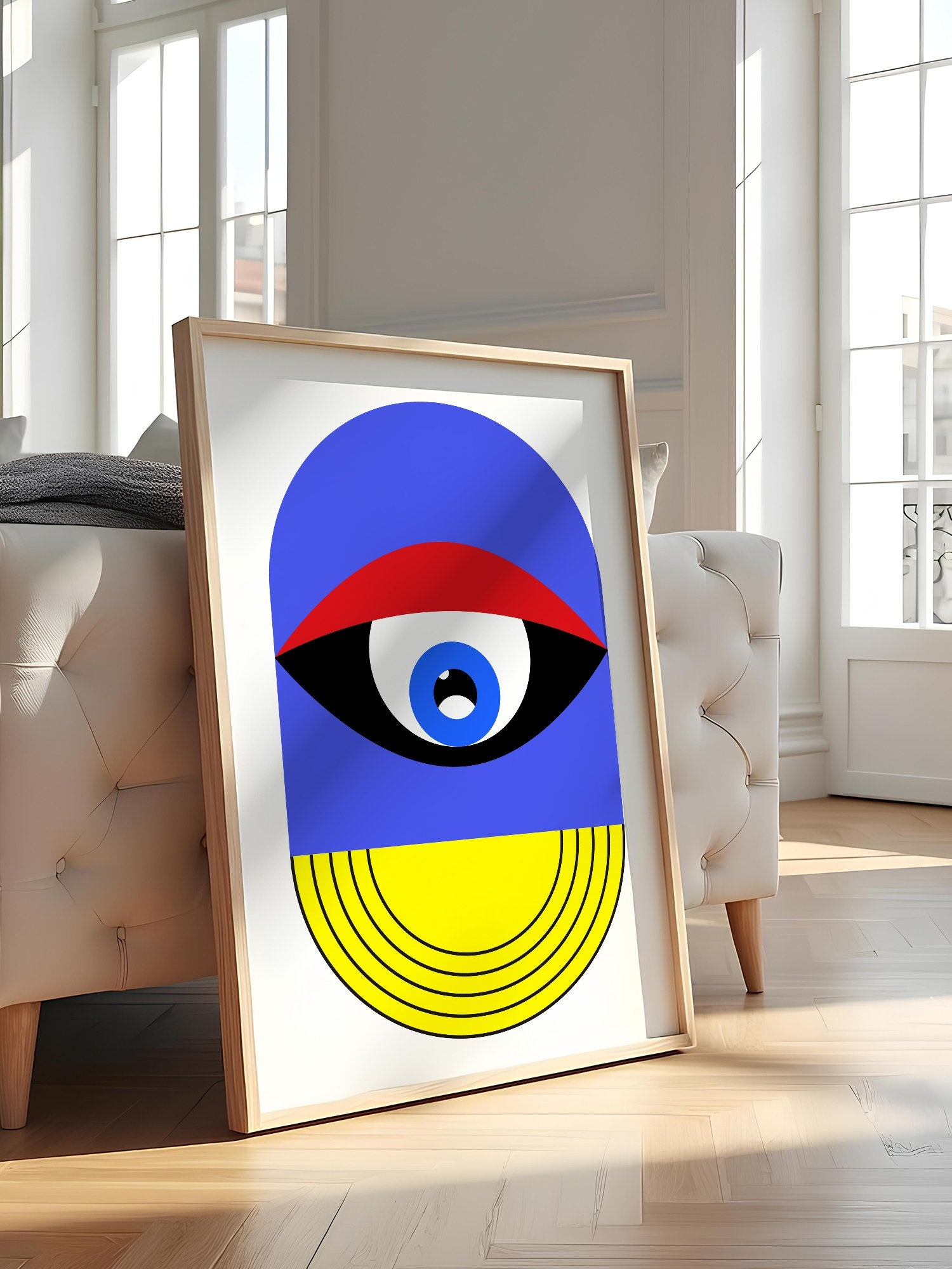 Pop art portrait print featuring geometric eye with concentric circles in blue, featured in stylish apartment decor