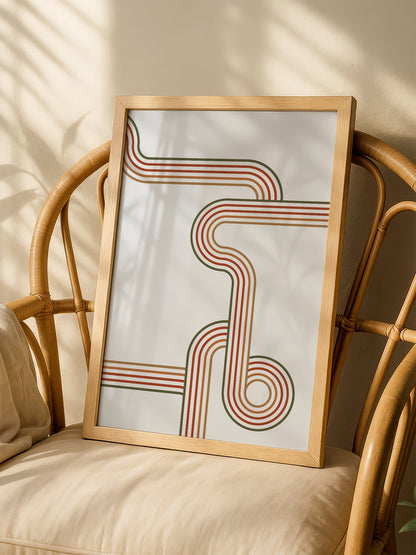 Abstract geometric wall art with flowing curved parallel lines in rust red, shown in minimalist home office space