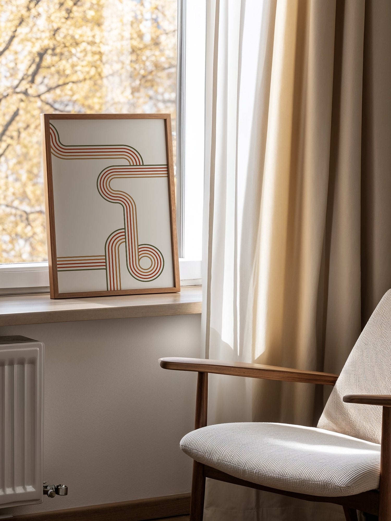Abstract geometric wall art with flowing curved parallel lines in rust red, mounted in bright gallery wall arrangement