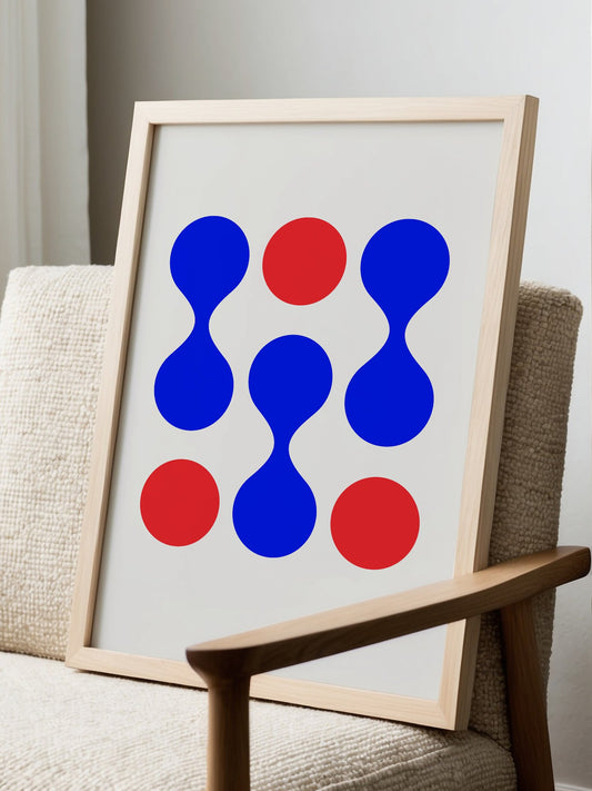 Geometric tic-tac-toe wall art with blue and red circles arranged in 3x3 grid, displayed in modern living room setting
